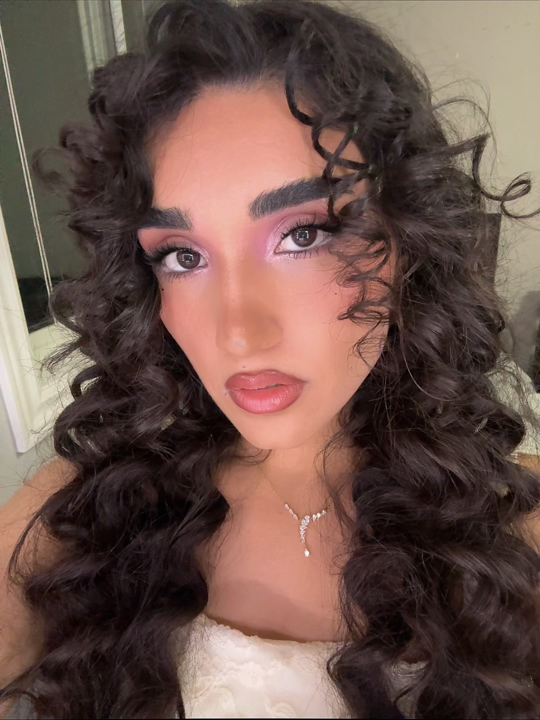 Kocer’s own look: a soft rose eye, defined lashes and curls